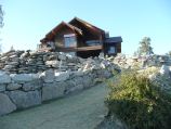 Boulder retaining walls outlining walkway