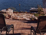 Paver patio fire pit overlooking the lake