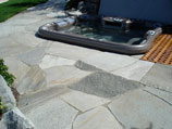 Flagstone patio inlay with inset hot tub