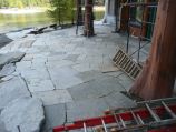 Flagstone placement and staging during construction