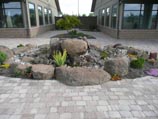 Countrystone paver in 'walnut' color and rock garden fountain