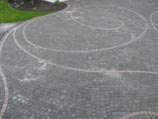 Spiral design cut into paver driveway