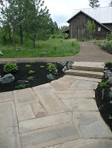 Fitted rock steps leading down from clay pathway