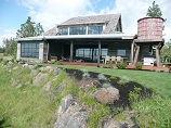 Landscaping blended with the natural vegetation to blend lawn with hillside