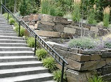 Multiple tier fitted rock retaining walls
