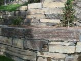 Stacked rock retaining walls