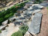 Stone stairway and boulder retaining wall