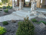 Sandstone stairs carefully cut and installed into paver walkway