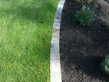 Paver edging for lawn and flower bed transition