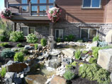 Multiple tiered water feature with fountain and collection ponds