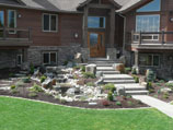 Pennsylvania sandstone stairway with water feature and boulder accents