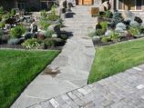 Pennsylvania sandstone steps and walkway connecting to European paver driveway