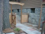 Square stepping stones with custom cedar fence and gate