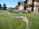 Highly contoured lawn with drystacked retaining walls