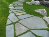 Flagstone walkway inset in grass