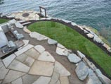 Flagstone patio with sod on lower level